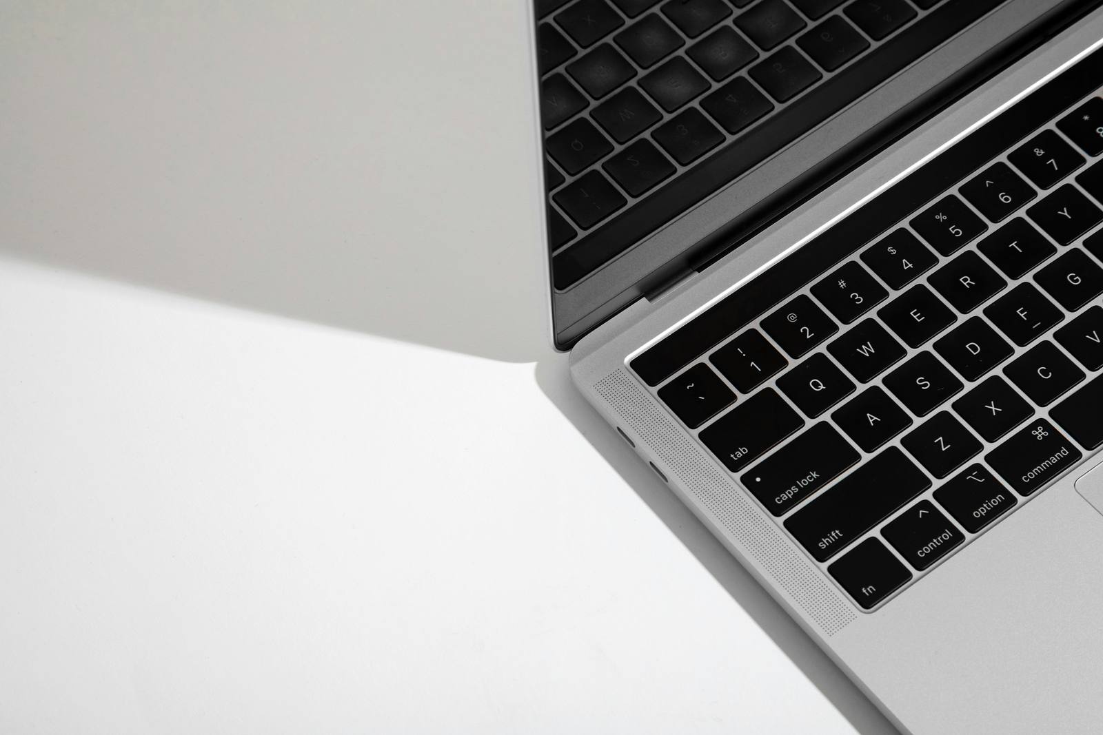 MacBook on a white desk